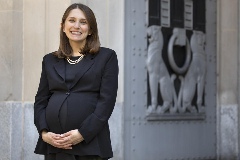 Attorney Erica Ross poses for a portrait, Monday, May 4, 2020, outside the Department of Justice in Washington, after Ross became the first attorney to argue in the first arguments that the Supreme Court has argued via telephone. (AP Photo/Jacquelyn Martin)