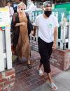 <p>Ashley Simpson cradles her baby bump as she and husband Evan Ross leave lunch with friends at The Ivy in Los Angeles. </p>