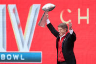 Kansas City Chiefs owner Clark Hunt holds the Super Bowl trophy during a rally in Kansas City, Mo., Wednesday, Feb. 5, 2020. (AP Photo/Orlin Wagner)