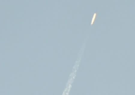 A flying object soars into the air above North Korean territory as seen from the Chinese border city of Dandong, in this photo taken by Kyodo February 7, 2016. EUTERS/Kyodo