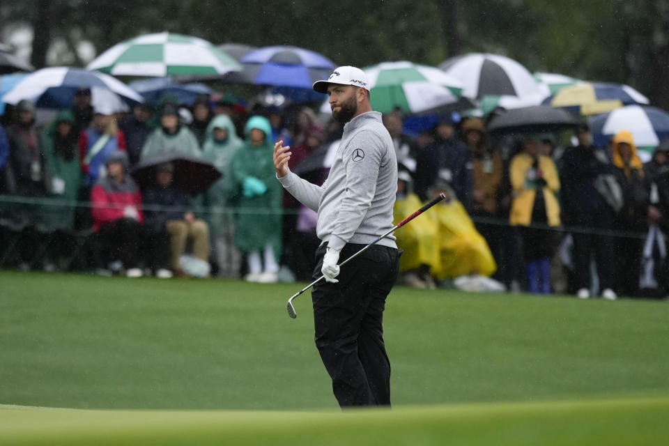 Jon Rahm, of Spain, reacts to his chip on the 18th hole during the weather delayed second round of the Masters golf tournament at Augusta National Golf Club on Saturday, April 8, 2023, in Augusta, Ga. (AP Photo/Matt Slocum)