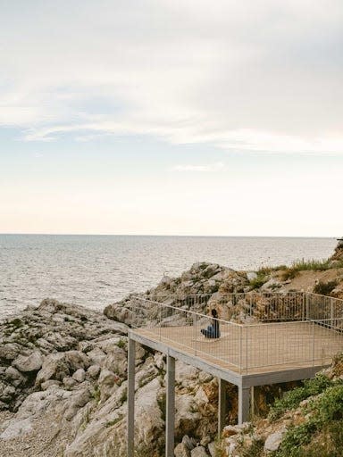 A woman practices yoga at the Mamula Island Hotel.