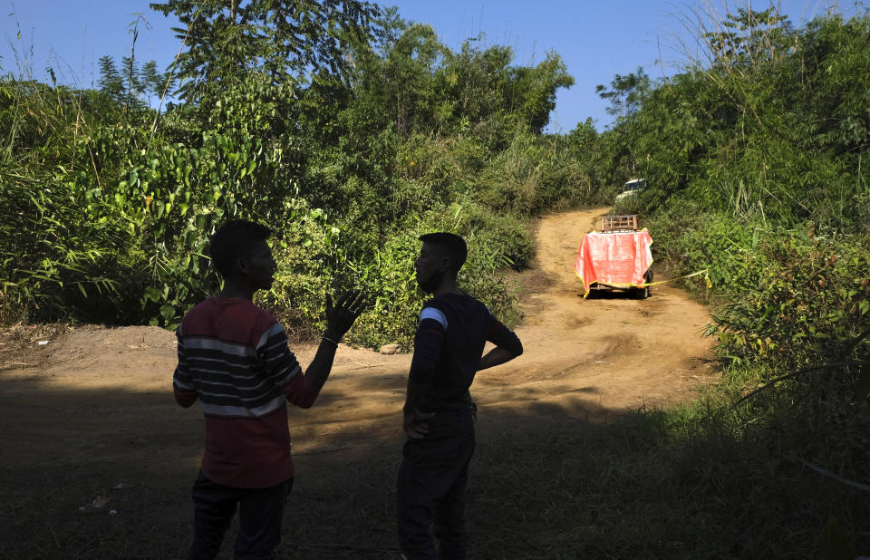 A man speaks standing near a truck that was ambushed by Indian army soldiers killing six civilians near Oting, in the northeastern Indian state of Nagaland, Wednesday, Dec. 15, 2021. Later that day, seven men that were part of a search party were killed by the soldiers. The incident earlier this month is the latest violence to shake the state of Nagaland and has left Oting village reeling in shock and grief for their lost ones. (AP Photo/Yirmiyan Arthur)