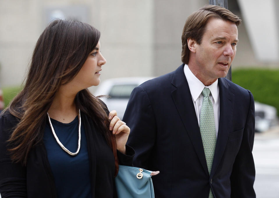 Former presidential candidate and Sen. John Edwards and his daughter Cate Edwards arrive at a federal courthouse in Greensboro, N.C., Wednesday, May 9, 2012. Edwards is accused of conspiring to secretly obtain more than $900,000 from two wealthy supporters to hide his extramarital affair with Rielle Hunter as well as her pregnancy. He has pleaded not guilty to six charges related to violations of campaign finance laws. (AP Photo/Gerry Broome)