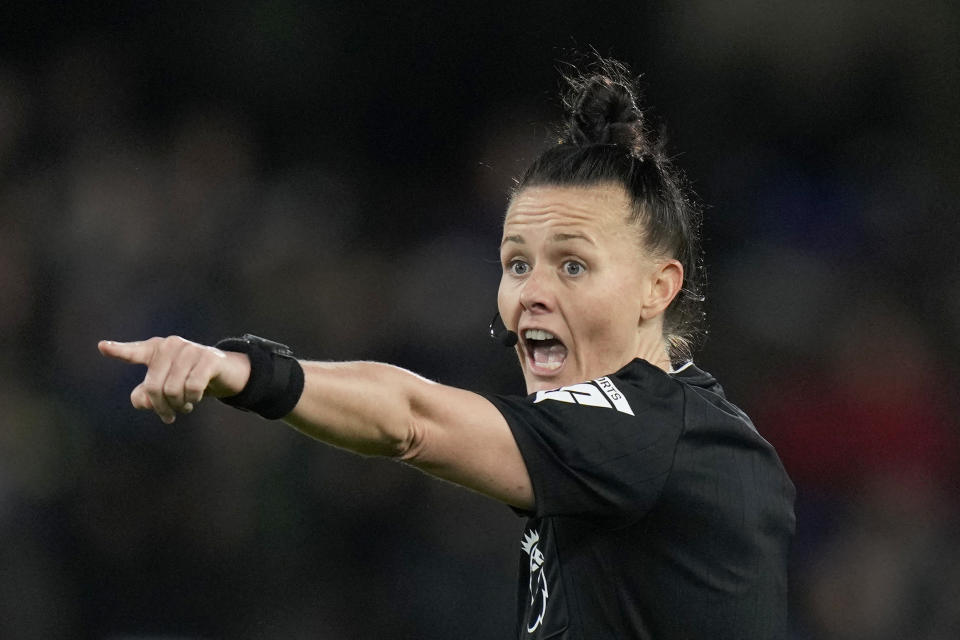 Referee Rebecca Welch gestures during the English Premier League soccer match between Fulham and Burnley at Craven Cottage stadium in London, Saturday, Dec. 23, 2023. Welch is the first female referee ever to officiate an English Premier League game. (AP Photo/Alastair Grant)