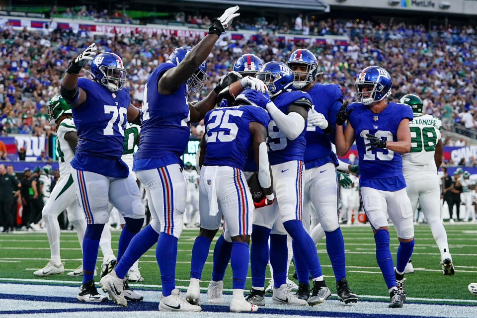 New York Giants running back Jashaun Corbin (25) celebrates his touchdown run during the first half of an NFL preseason football game against the New York Jets, Saturday, Aug. 26, 2023, in East Rutherford, N.J. (AP Photo/Frank Franklin II)