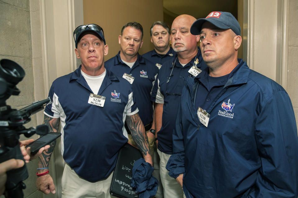 Sept. 11 first responders John Feal, left, Ret. Lt. Michael O'Connell, right, and other first responders speak to reporters as they leave the office of Senate Majority Leader Mitch McConnell, following their meeting at McConnell's office on Capitol Hill in Washington, Tuesday, June 25, 2019. (AP Photo/Manuel Balce Ceneta)