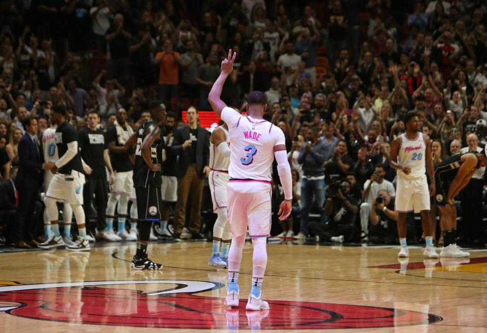 Miami Heat fans show their support as Heat guard Dwyane Wade enter the game during the first quarter of the NBA basketball against the Milwaukee Bucks at the AmericanAirlines Arena in Miami on Friday, February 9, 2018.