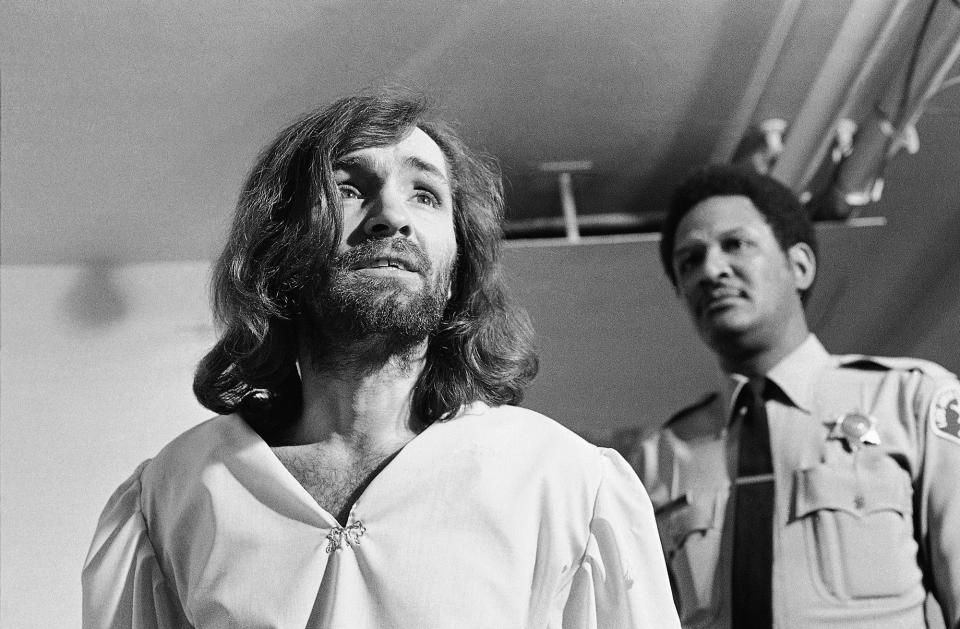 <p>Charles Manson replies, “It all depends on your point of view,” after a newsman asks him, “Are you insane, Charlie?” March 19, 1970, in Los Angeles. The exchange came as Manson left court, where he won permission to hire a new attorney, replacing one who had attempted to have Manson examined by psychiatrists. (Photo: George Brich/AP) </p>