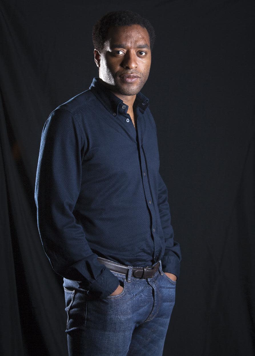 This Sept. 14, 2013 photo shows British actor Chiwetel Ejiofor from the film "12 Years A Slave," in New York. Ejiofor portrays Solomon Northup, a free black man who was abducted and sold into slavery in this pre-Civil War drama. (Photo by Carlo Allegri/Invision/AP)