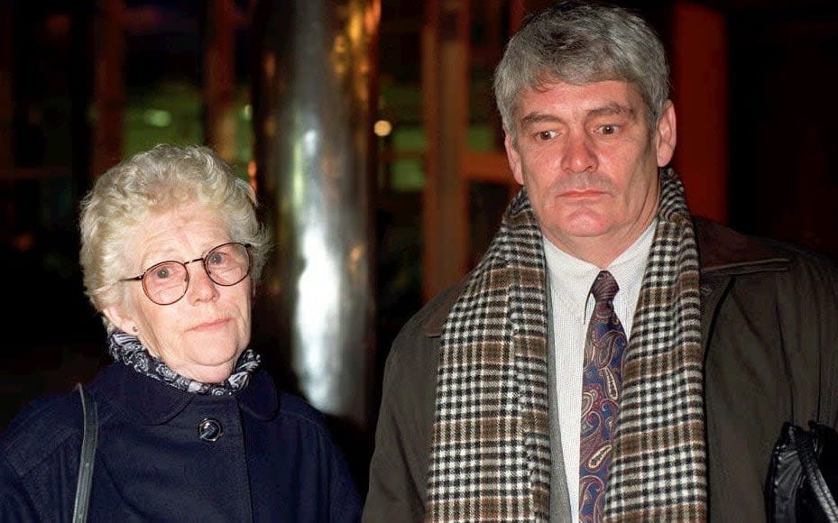 Alastair Morgan and his mother, Isobel Hulsmann, arriving at Scotland Yard in 1997 - PA