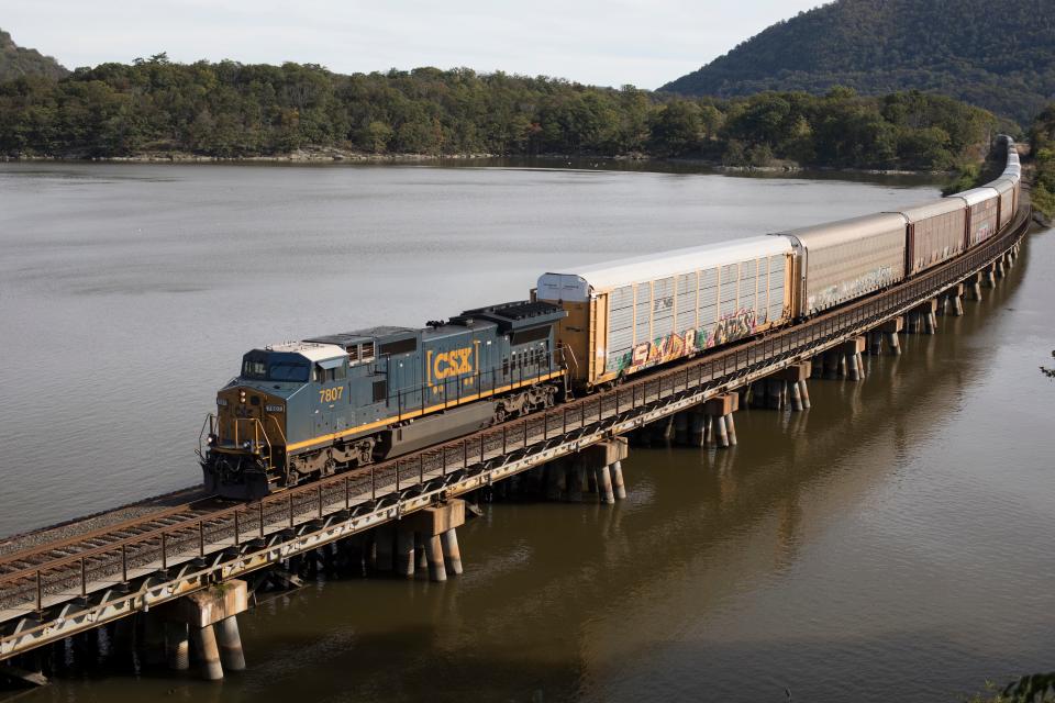 A CSX freight train of autoracks crosses a bridge from Iona Island to the west shore of the Hudson River near Bear Mountain, N.Y., on Oct. 16, 2018, on the railroad's River Subdivision.