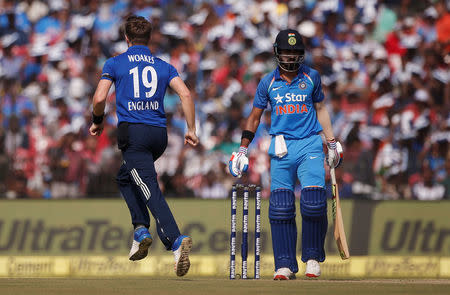 Cricket - India v England - Second One Day International - Barabati Stadium, Cuttack, India - 19/01/17. England's Chris Woakes (L) celebrates the dismissal of India's Lokesh Rahul. REUTERS/Adnan Abidi