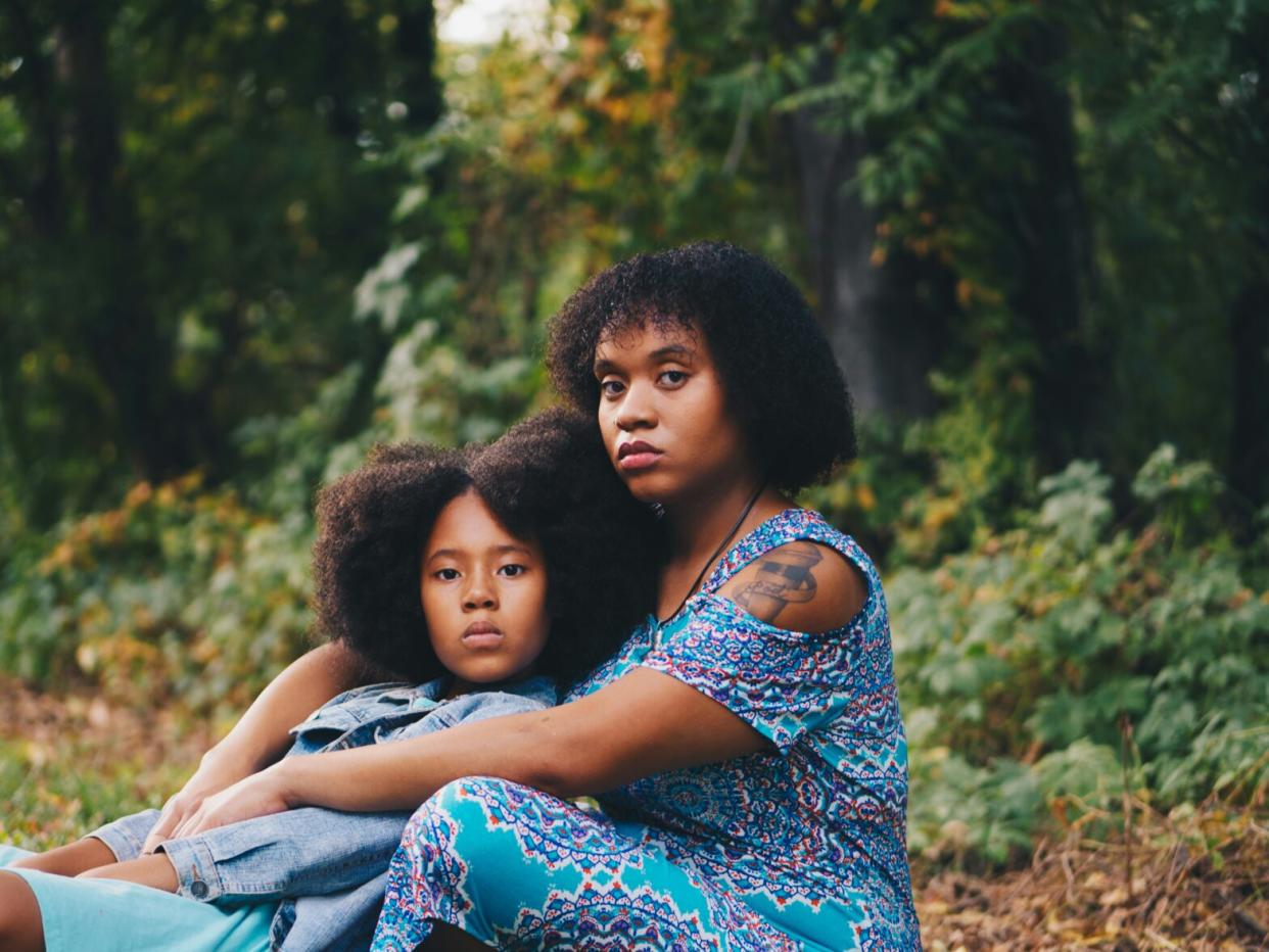 woman and young girl in the woods