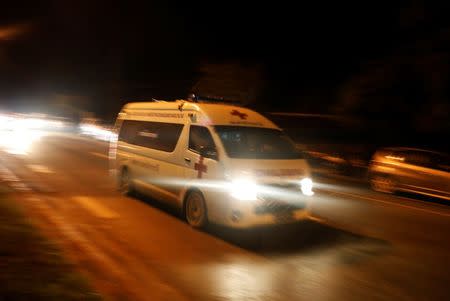 An ambulance believed to be carrying rescued schoolboys travels to a military helipad near Tham Luang cave complex in the northern province of Chiang Rai. Source: Reuters