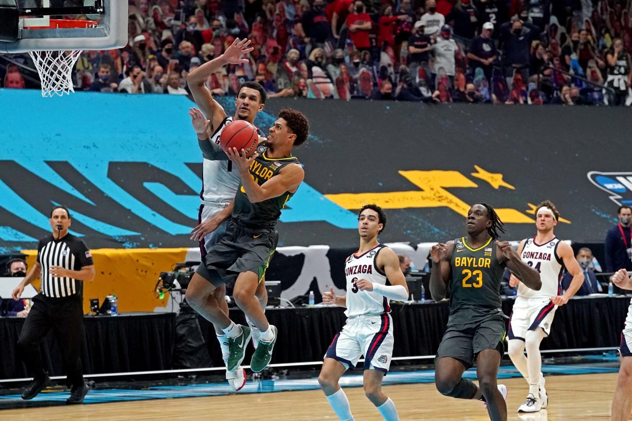 Baylor guard MaCio Teague (31) shoots the ball against Gonzaga guard Jalen Suggs (1) during the national championship game of the 2021 NCAA men's tournament at Lucas Oil Stadium.
