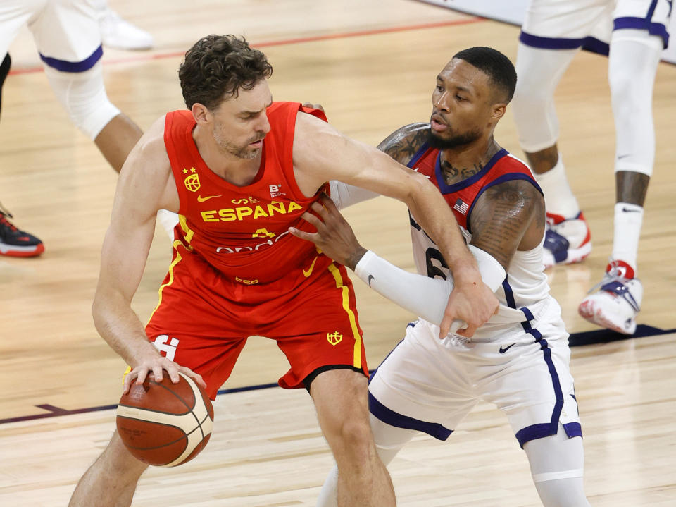 LAS VEGAS, NEVADA - JULY 18:  Pau Gasol #4 of Spain is guarded by Damian Lillard #6 of the United States during an exhibition game at Michelob ULTRA Arena ahead of the Tokyo Olympic Games on July 18, 2021 in Las Vegas, Nevada. The United States defeated Spain 83-76.  (Photo by Ethan Miller/Getty Images)