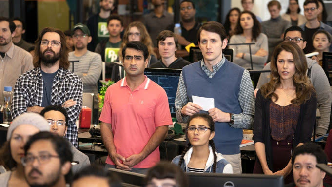 Martin Starr, Kumail Nanjiani, Zach Woods, and Amanda Crew stand in a crowd watching something