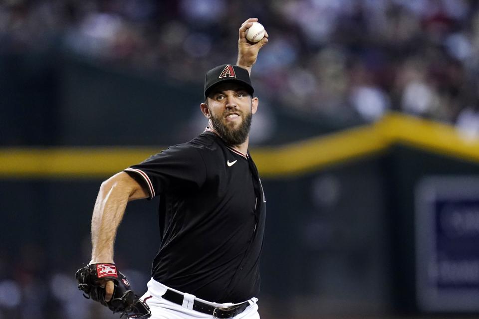 Arizona Diamondbacks starting pitcher Madison Bumgarner throws to a Washington Nationals batter during the third inning of a baseball game Saturday, July 23, 2022, in Phoenix. (AP Photo/Ross D. Franklin)