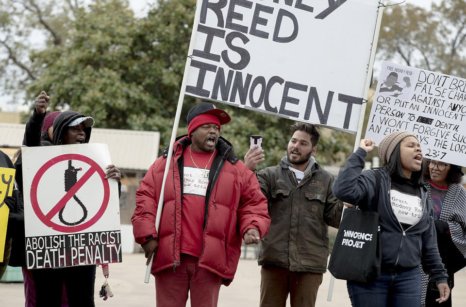 People chant along a street during a protest against the execution of Rodney Reed on Wednesday, Nov. 13, 2019, in Bastrop, Texas. Protesters rallied in support of Reed’s campaign to stop his scheduled Nov. 20 execution for the 1996 killing of a 19-year-old Stacy Stites. New evidence in the case has led a growing number of Texas legislators, religious leaders and celebrities to press Gov. Greg Abbott to intervene. (Nick Wagner/Austin American-Statesman via AP)