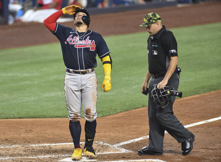 Atlanta Braves William Contreras crosses home plate after hitting a solo home run during the fifth inning against the Miami Marlins in a baseball game Saturday May 21, 2022, in Miami. (AP Photo/Gaston De Cardenas)