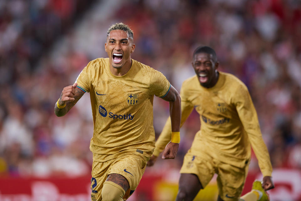 SEVILLE, SPAIN - SEPTEMBER 03: Raphael Dias Belloli 'Raphinha' of FC Barcelona celebrates scoring their teams first goal with team mates during the LaLiga Santander match between Sevilla FC and FC Barcelona at Estadio Ramon Sanchez Pizjuan on September 03, 2022 in Seville, Spain. (Photo by Fran Santiago/Getty Images)