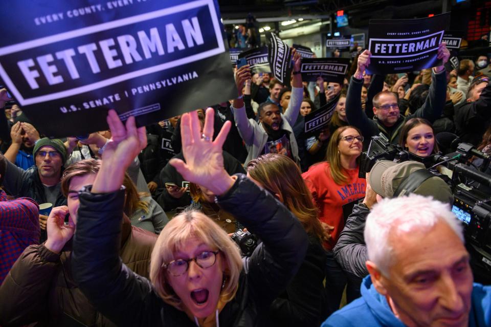 Supporters cheer during an election night event for Pennsylvania Gov. John Fetterman on Nov. 9 in Pittsburgh. Fetterman, a Democrat, defeated Republican Dr. Mehmet Oz for a U.S. Senate seat.