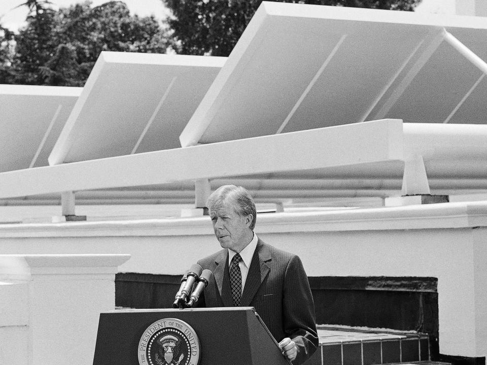 Jimmy Carter speaks in front of the White House solar panels in 1979