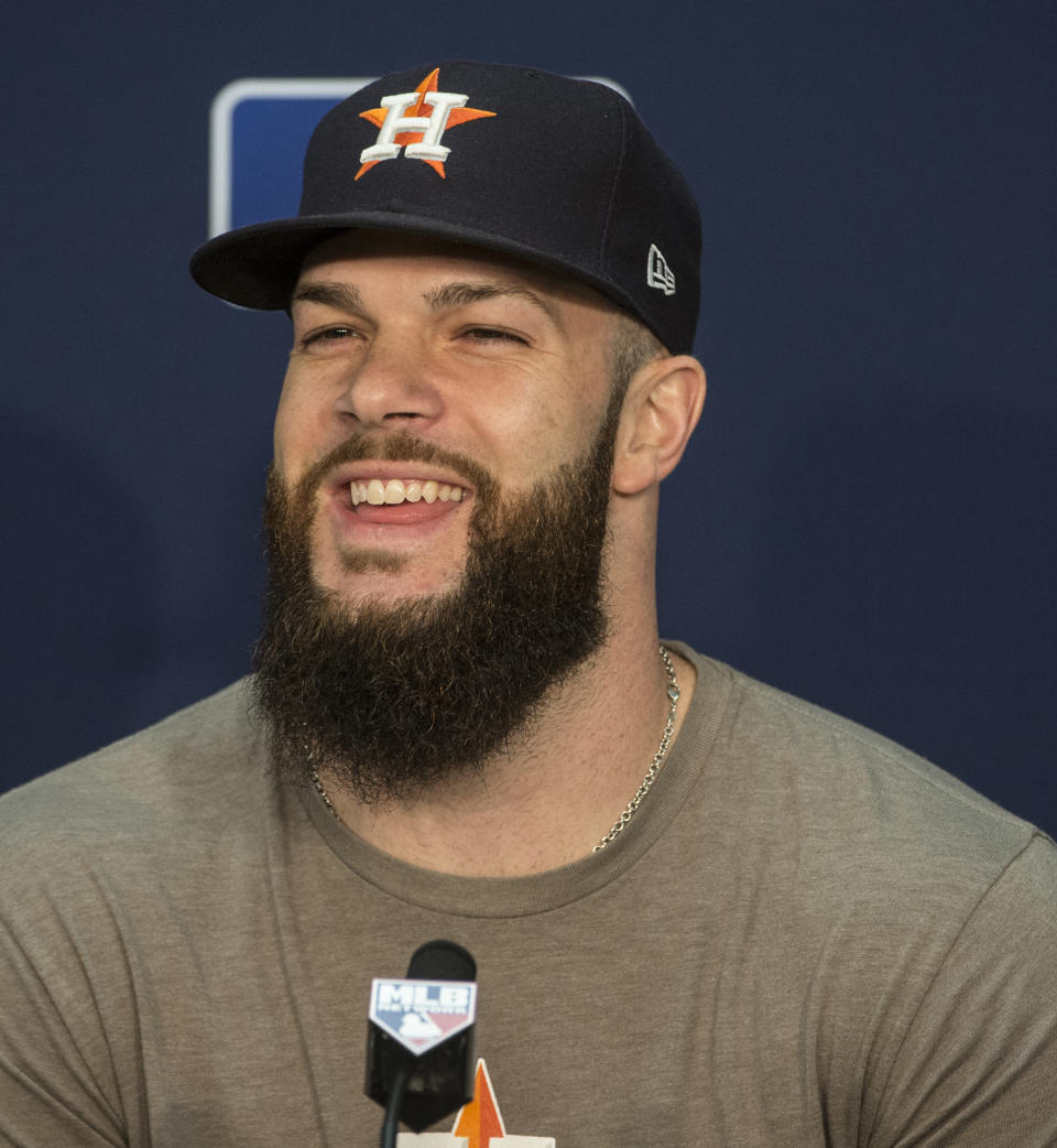 Houston Astros starting pitcher Dallas Keuchel answers a question during a press conference before a workout in Cleveland, Sunday, Oct. 7, 2018. Keuchel will pitch against the Cleveland Indians in the third game of their ALDS series, Monday. (AP Photo/Phil Long)