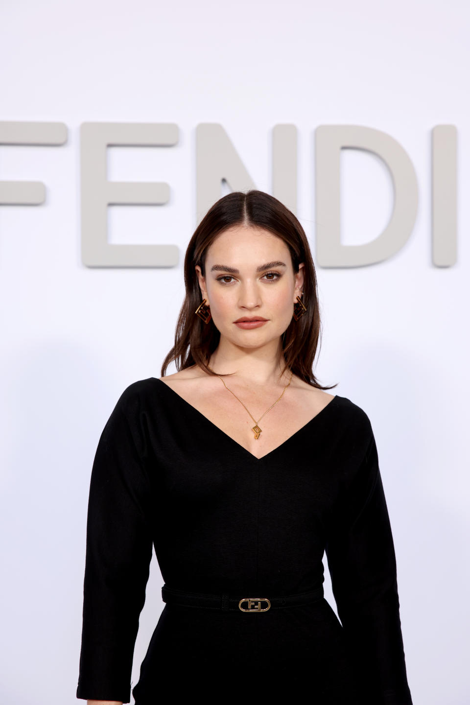 lily james poses for photographers on the red carpet