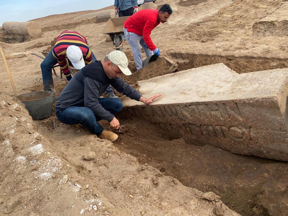 This undated photo provided by the Egyptian Tourism and Antiquities Ministry on Monday, April 25, 2022, shows archeologists working in the ruins of a temple for Zeus-Kasios, the ancient Greek god, at the Tell el-Farma archaeological site in the northwestern corner of the Sinai Peninsula. Tell el-Farma, also known by its ancient name Pelusium, dates back to the late Pharaonic period and was also used during Greco-Roman and Byzantine times. (Egyptian Tourism and Antiquities Ministry via AP)