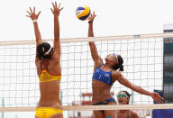 HAIYANG, CHINA - JUNE 18: Varapatsorn Radarong of Thailand spikes against Chunxia Chen of China during their Beach Volleyball Women's Gold Medal match with Tanarattha Udomchavee of Thailand and Anna Hu of China on Day 2 of the 3rd Asian Beach Games Haiyang 2012 at Fengxiang Beach on June 18, 2012 in Haiyang, China. (Photo by Ryan Pierse/Getty Images)