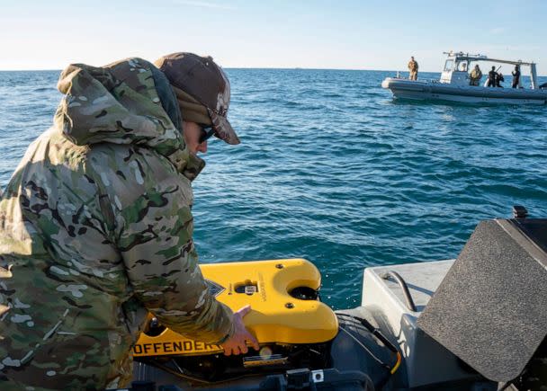 PHOTO: Sailors assigned to Explosive Ordnance Disposal Group 2 prepare an underwater vehicle to search for debris during recovery efforts of a high-altitude balloon in the Atlantic Ocean, Feb. 7, 2023. (Mass Communication Specialist 1st Class Ryan Seelbach/U.S. Navy)