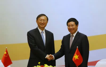 China's State Councilor Yang Jiechi (L) and Vietnam's Deputy Prime Minister and Foreign Minister Pham Binh Minh shake hands after a meeting at the International Convention Center in Hanoi, Vietnam June 27, 2016. REUTERS/Kham