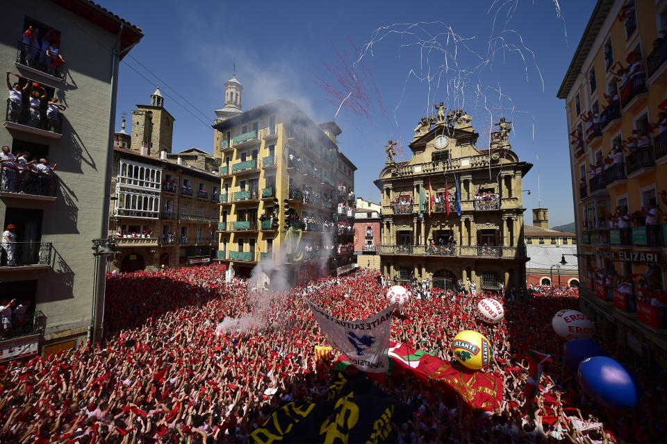 Revellers celebrate the official opening of the 2019 San Fermin fiestas in Pamplona, Spain, Saturday July 6, 2019. (Photo: Alvaro Barrientos/AP)