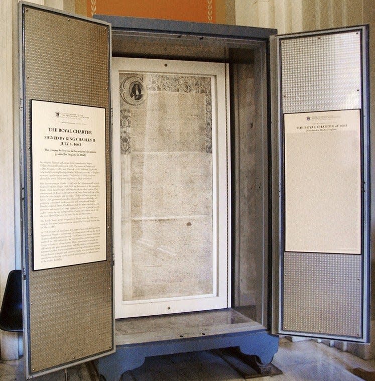 This file photo shows Rhode Island's Royal Charter, signed by King Charles II on July 8, 1663, is in a protective case at the State House. The charter has since moved to a new location.