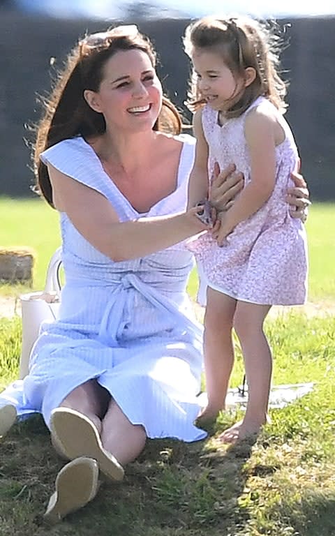 Family day out: Prince William was playing at the Beaufort Polo Club while his family looked on - Credit: James Whatling