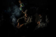 <p>A migrants from Pakistan is seen while warming him self up near a fire within an abandoned warehouse near the Central train station in Belgrade, Serbia, Wednesday, Feb. 2017. (Manu Brabo/MeMo) </p>