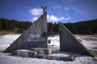 A view of the remains of the podium used for medal ceremonies on Igman mountain near Sarajevo, Bosnia, Wednesday, Feb. 7, 2024. Sarajevo is paying tribute this week to one of its most glorious moments: the two weeks of February in 1984 when it staged an impeccable Winter Olympic Games. While taking the nostalgic trip down memory lane, Bosnian Olympians say they are looking to the future with hope to again pull off an “apparently impossible feat” and reignite the Olympic flame over Sarajevo in 2032. (AP Photo/Armin Durgut)