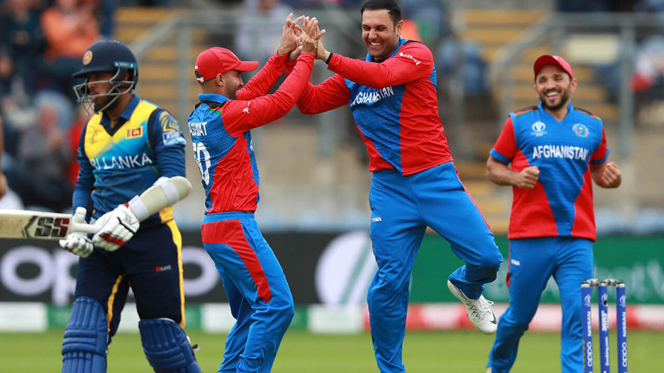 Mohammad Nabi celebrates. (Photo by David Rogers/Getty Images)