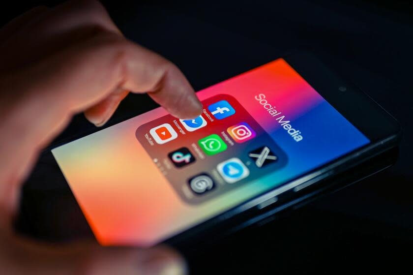 Close - up finger pointing to Messenger mobile app displayed on a smartphone screen alongside that of X,Whatsapp,Facebook,TikTok,Threads, on August 15, 2023, in Brussels, Belgium. (Photo illustration by Jonathan Raa/NurPhoto via Getty Images)