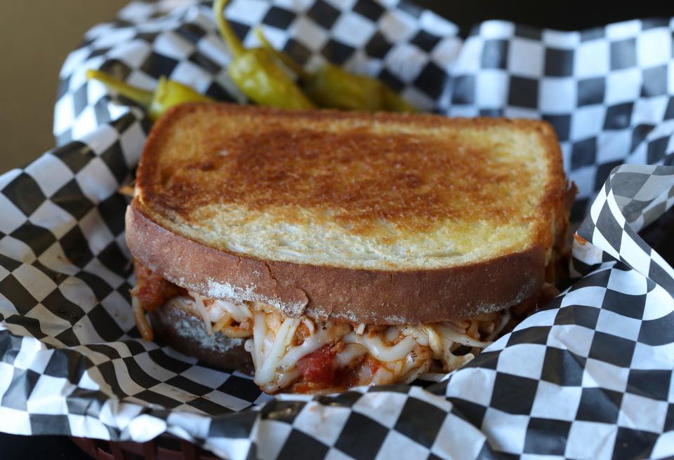 The Bossalinie is described as a spaghetti melt sandwich between garlic toast served at Melt 502 in Louisville, Ky. on Jan. 18, 2022.  