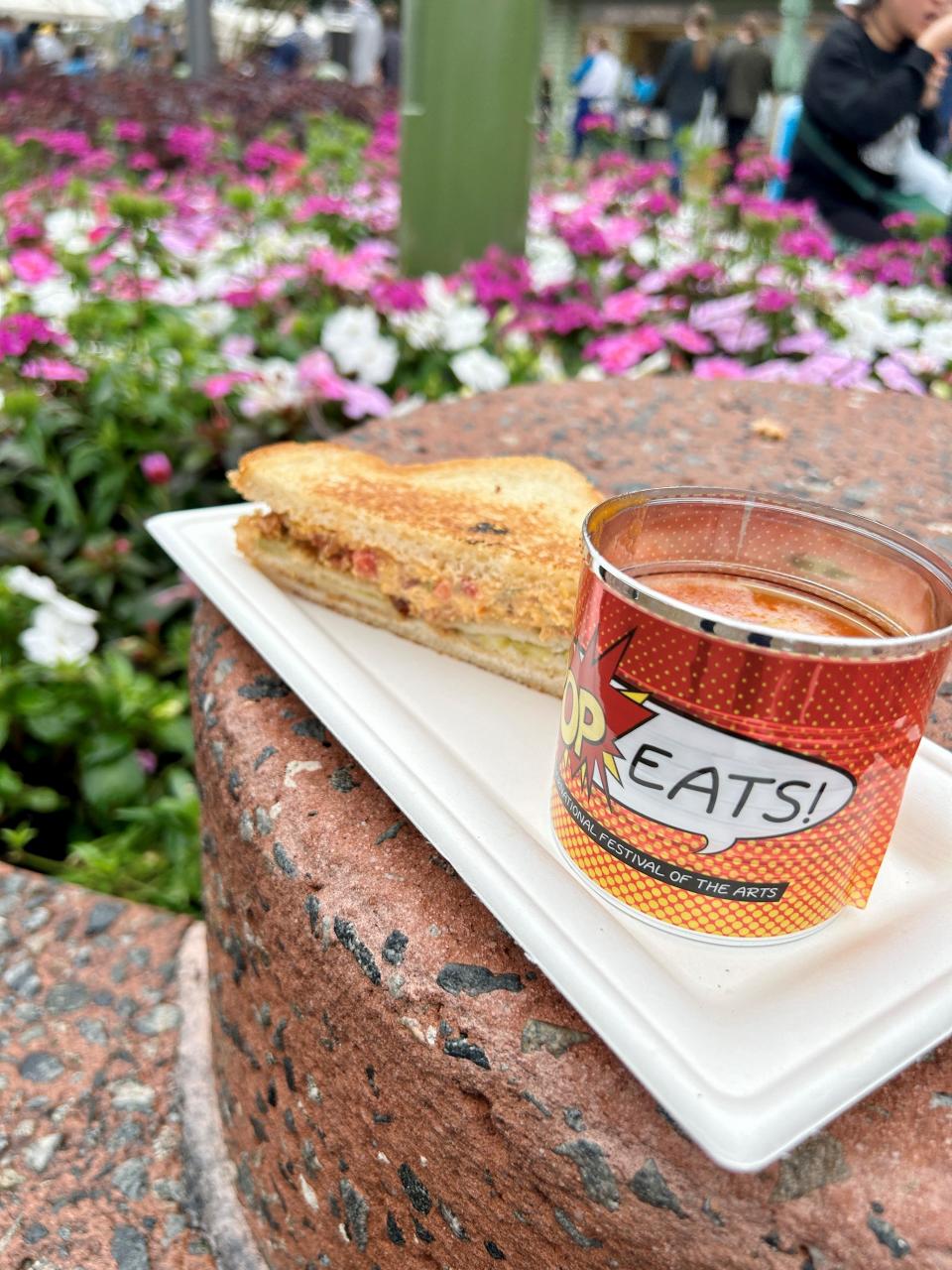 Tomato soup with pimento cheese, bacon and fried green tomato grilled cheese is a classic dish at the 2024 EPCOT International Festival of the Arts.