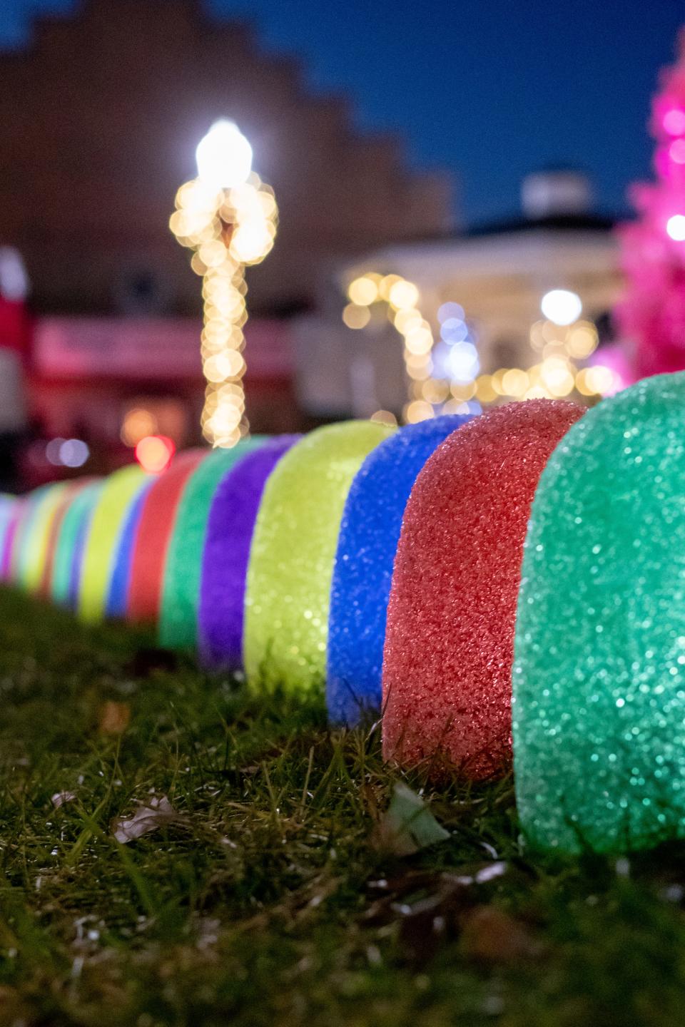 Colorful lines of gumdrops illuminated pathways around the Noble County courthouse during the Village Christmas to Remember celebration.