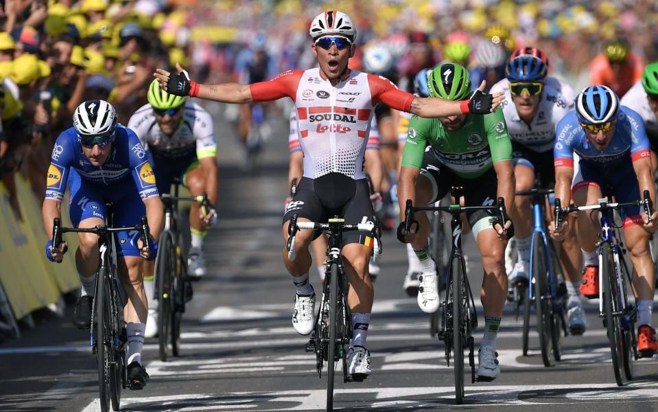 Australia's Caleb Ewan (C) celebrates as he wins on the finish line of the sixteenth stage of the 106th edition of the Tour de France - AFP