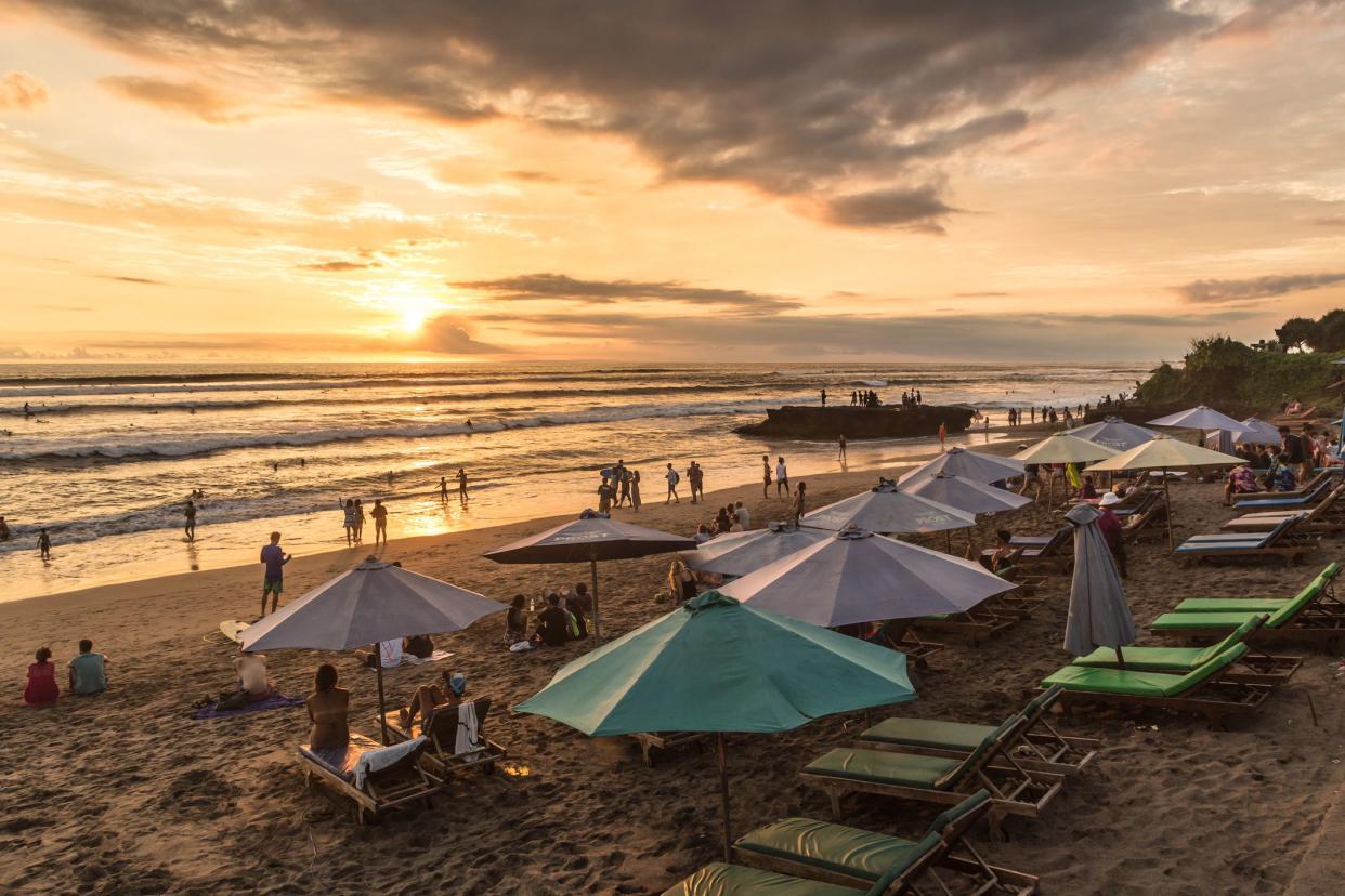 people enjoy the sunset over beach, Canggu, Bali