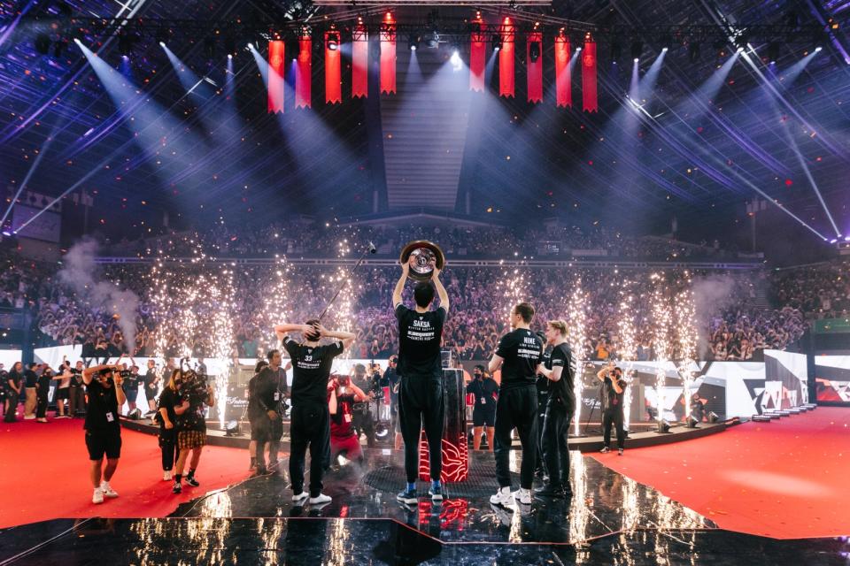 Tundra Esports raise the Aegis of Champions in front of a roaring crowd in Singapore after being crowned as champions of The International 11. (Photo: Valve Software)