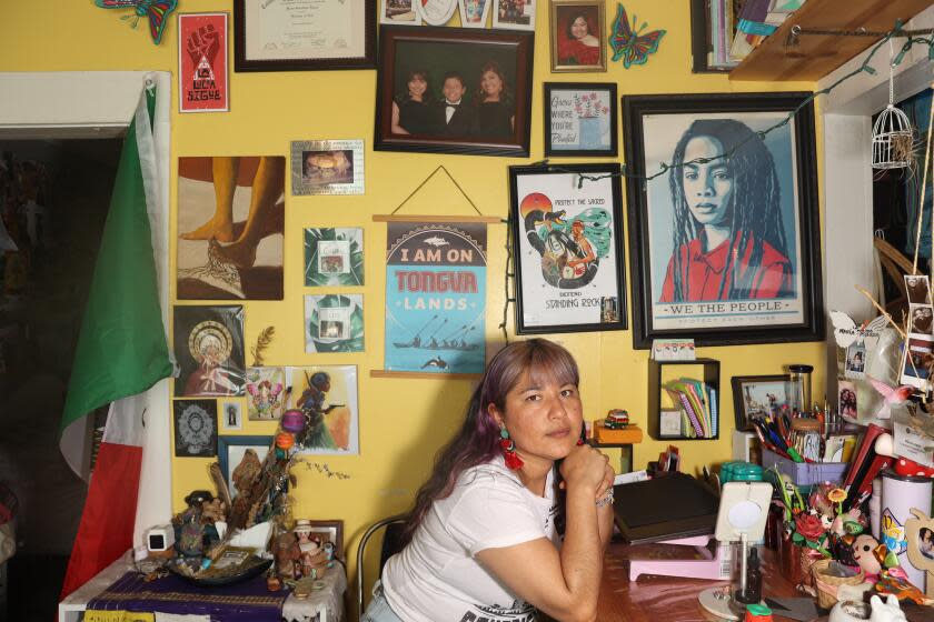 Long Beach, CA - June 14: Maria Lopez poses for a portrait in her home of over three decades on Friday, June 14, 2024 in Long Beach, CA. Lopez is being evicted from her home of three decades in Long Beach for what the landlord says is a "substantial remodel." Advocates say this is a loophole in eviction rules that allows landlords to evict people from rent-controlled units. (Michael Blackshire / Los Angeles Times)