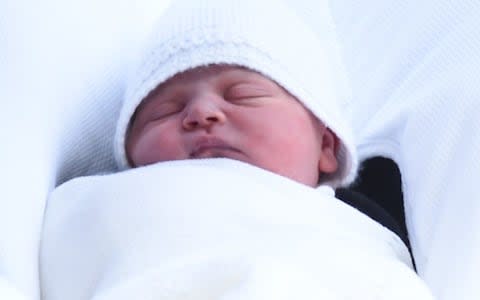 A close-up of the Royal baby's face - Credit: Eddie Mulholland/The Telegraph