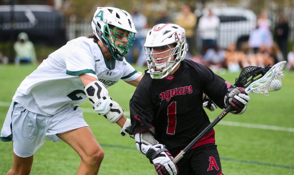 Archmere's Drew Duncan defends against Appoquinimink's David Lubrano.